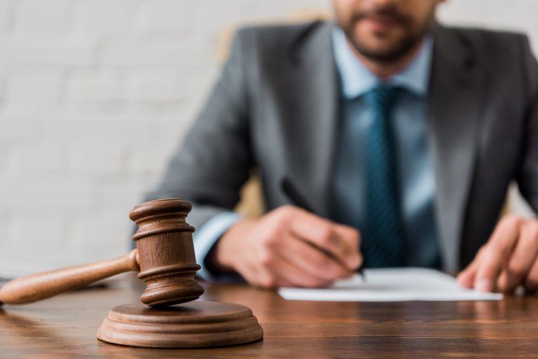 Attorney Signing Paperwork | Employment Attorney in Bloomington, IL